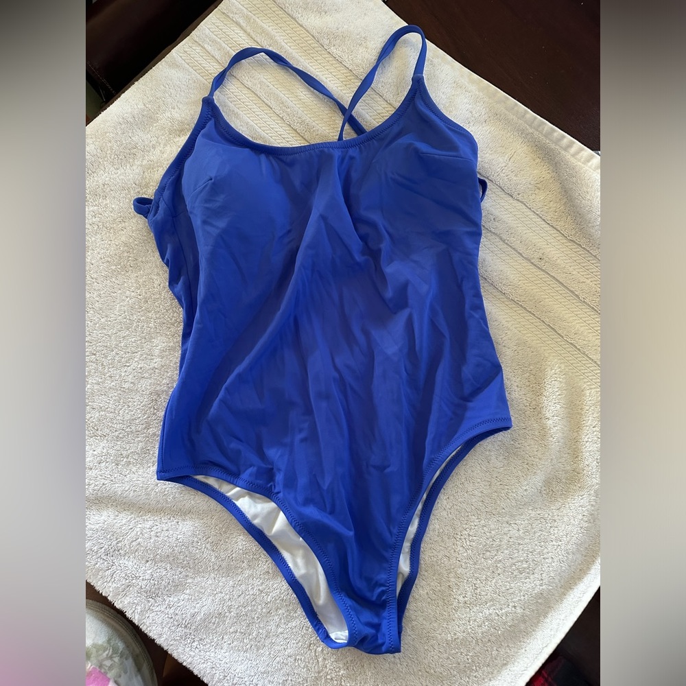 PINK one piece swimsuit. Size large. Never worn. Sanitary tape is gone. No tag.